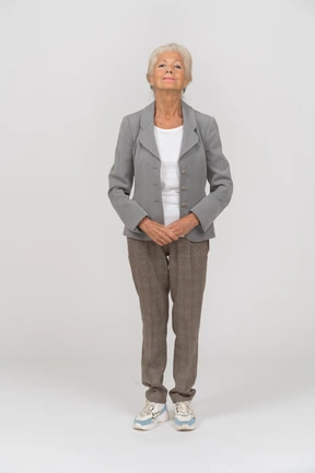Front view of a happy old lady looking at camera