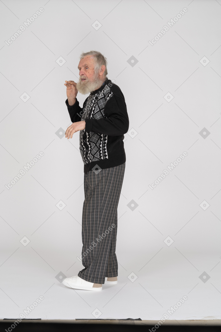 Old man gesturing with hands
