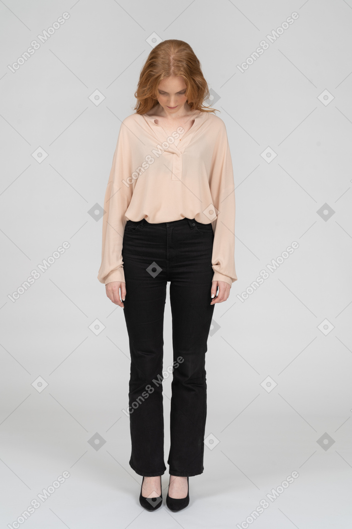 Woman in beautiful blouse standing