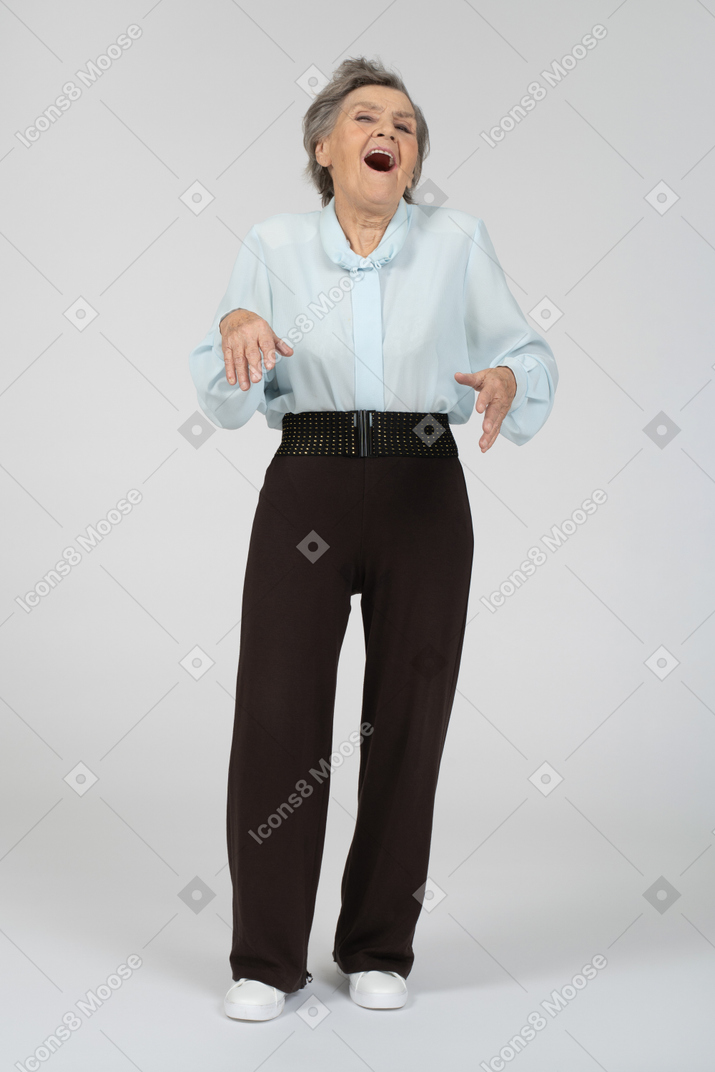 Front view of an old woman laughing loudly