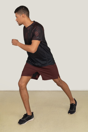 Young man in sports clothes exercising