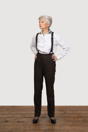 Businesswoman looking concerned with hands on hips