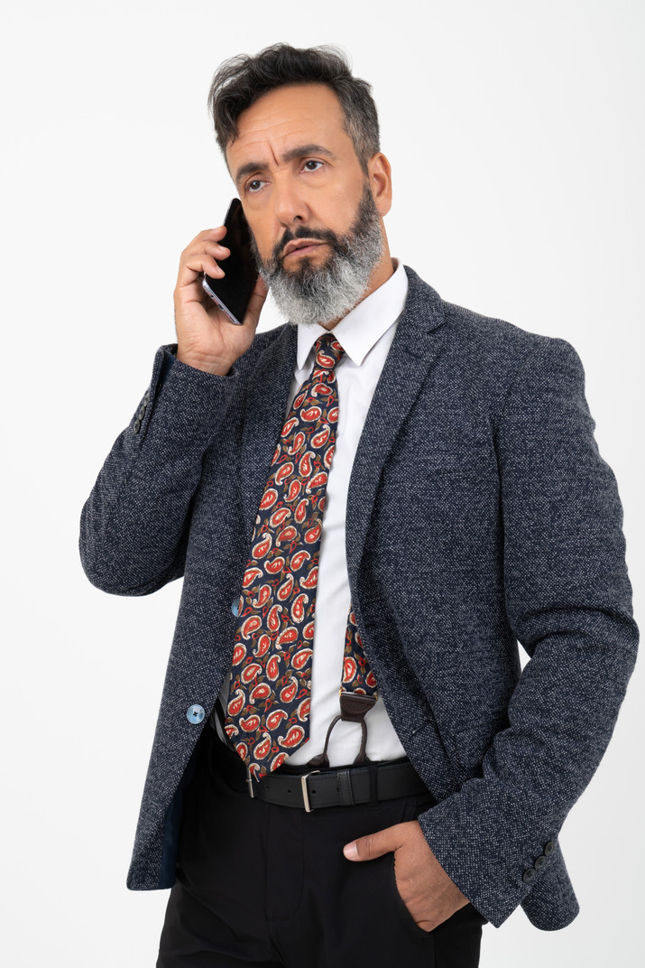 Man in formal clothes talking on the phone