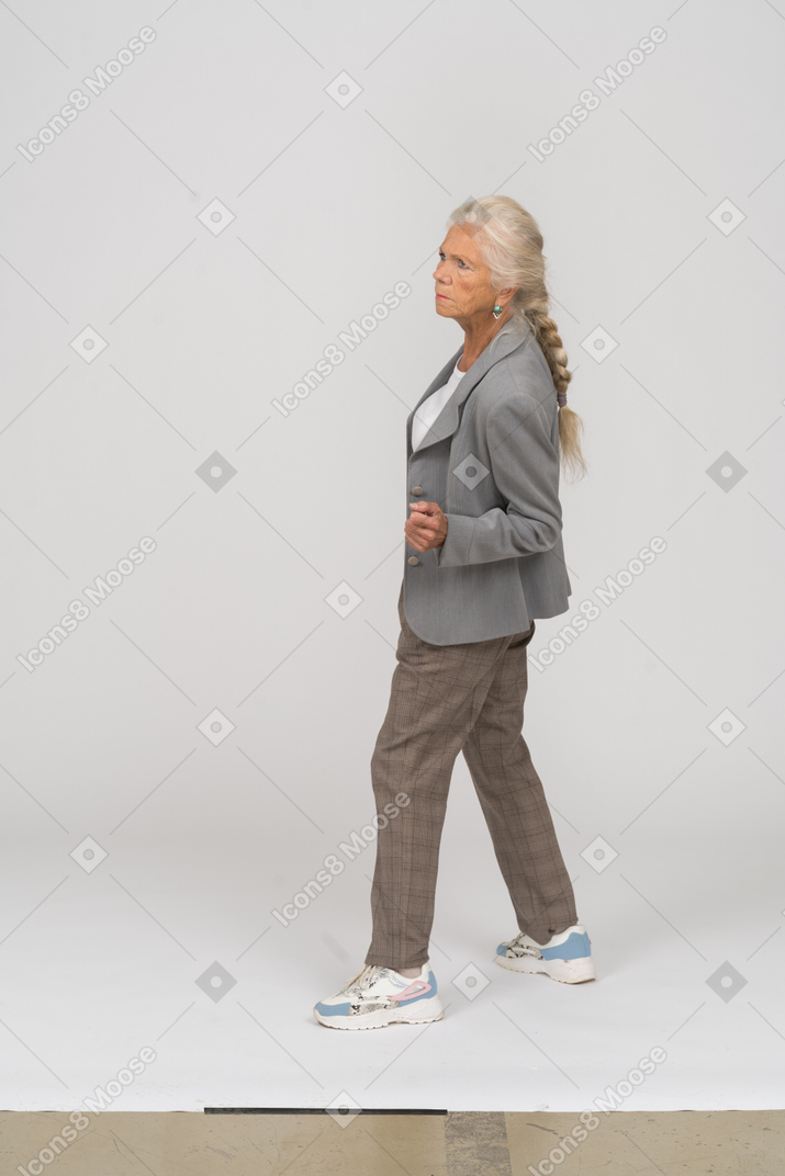 Old lady in suit posing in profile