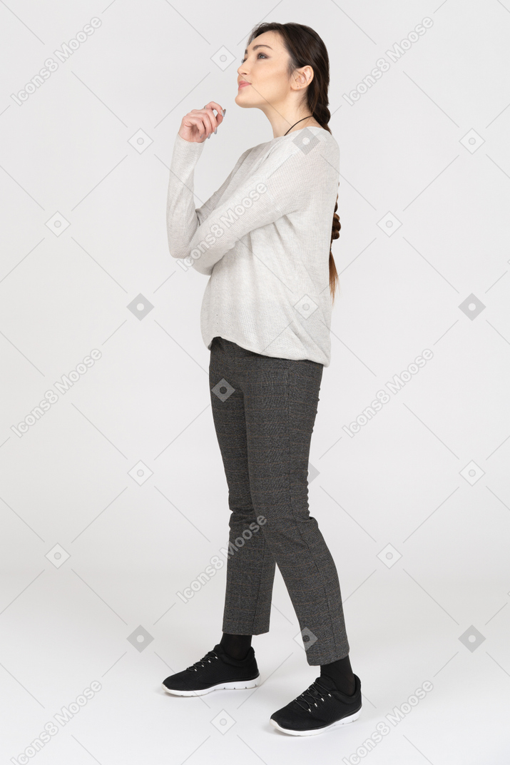 Thoughtful caucasian female daydreaming on white background