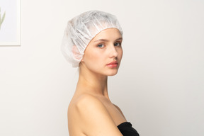 Portrait of a young female patient in medical cap