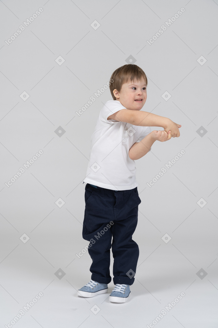Little boy reaching his arms to the side