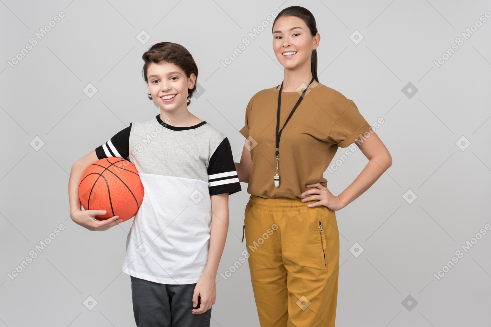 Smiling physical education teacher and pupil