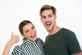 Young beautiful couple smiling happily