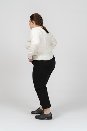 Side view of plus size woman in casual clothes