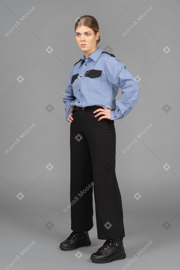 Female security guard looking with a suspicion