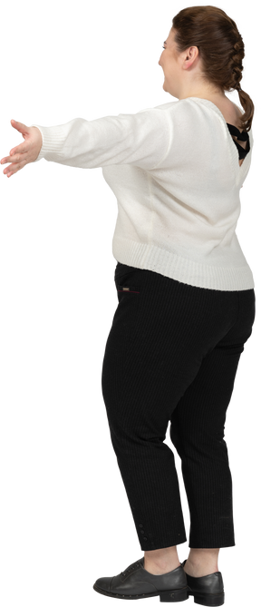 Happy plus size woman in white sweater