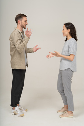 Side view of young couple speaking to each other