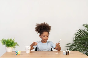 Good looking cute girl doing science at the table