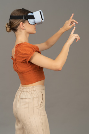 Side view of young woman in vr headset