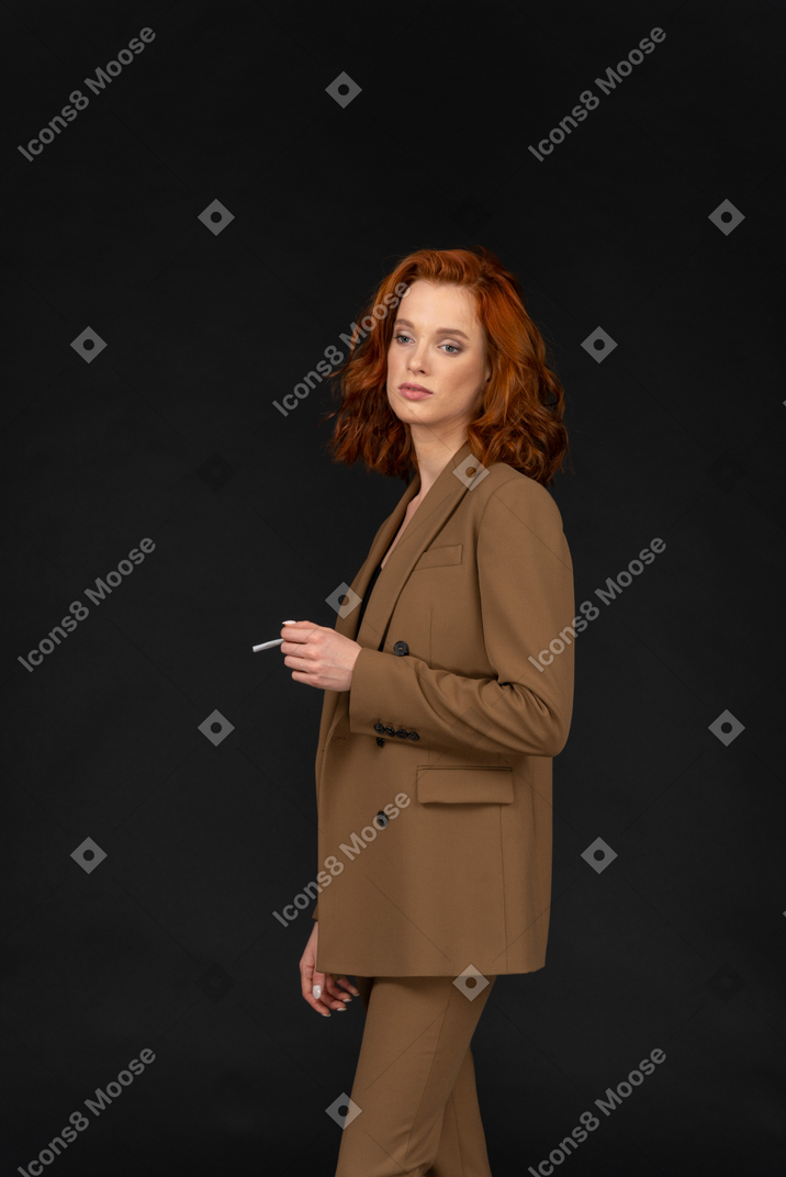 Young businesswoman holding a cigarette