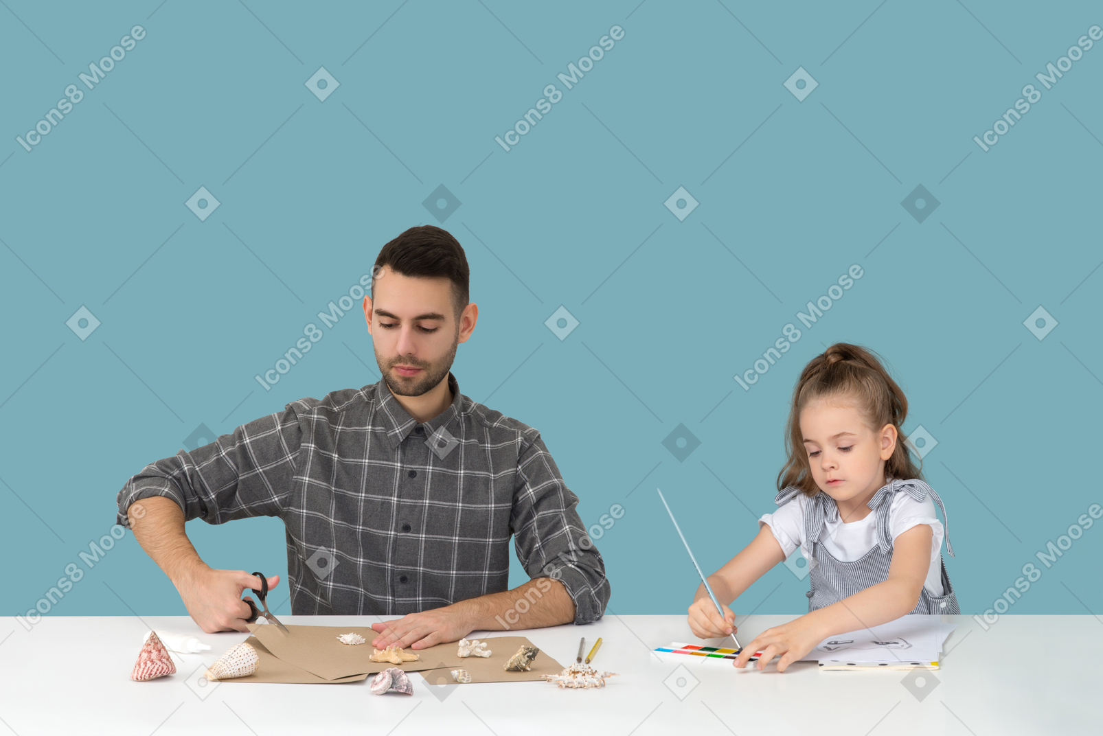 Dad and daughter spending time together and doing some craft