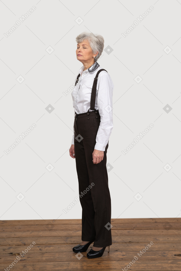 Three-quarter view of a sleepy old lady in office clothing