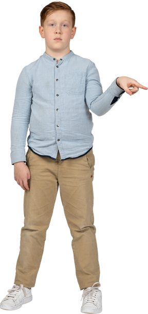 Front view of a boy pointing with finger
