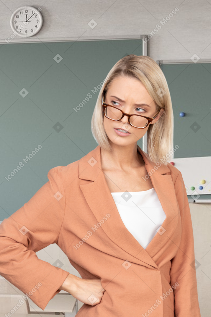 A female teacher standing in class