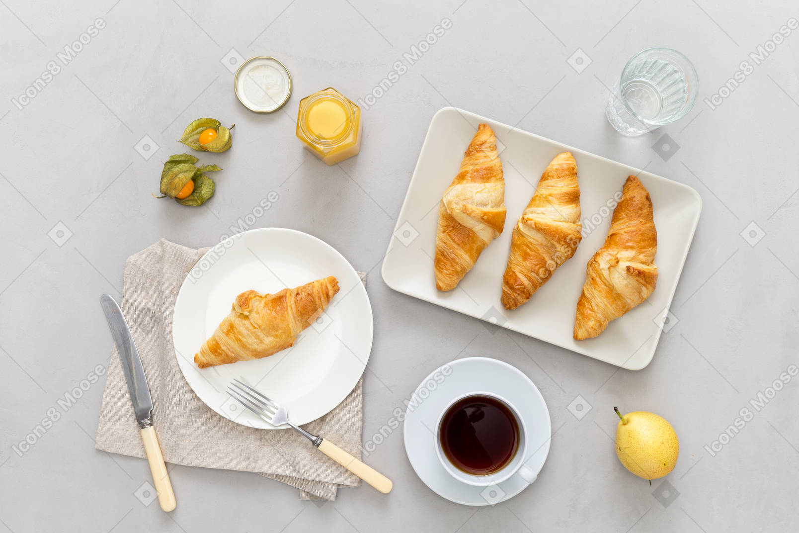 Some coffee, croissants, honey and a pear