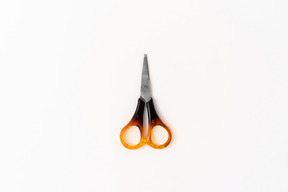 Colorful scissors on white bakcground