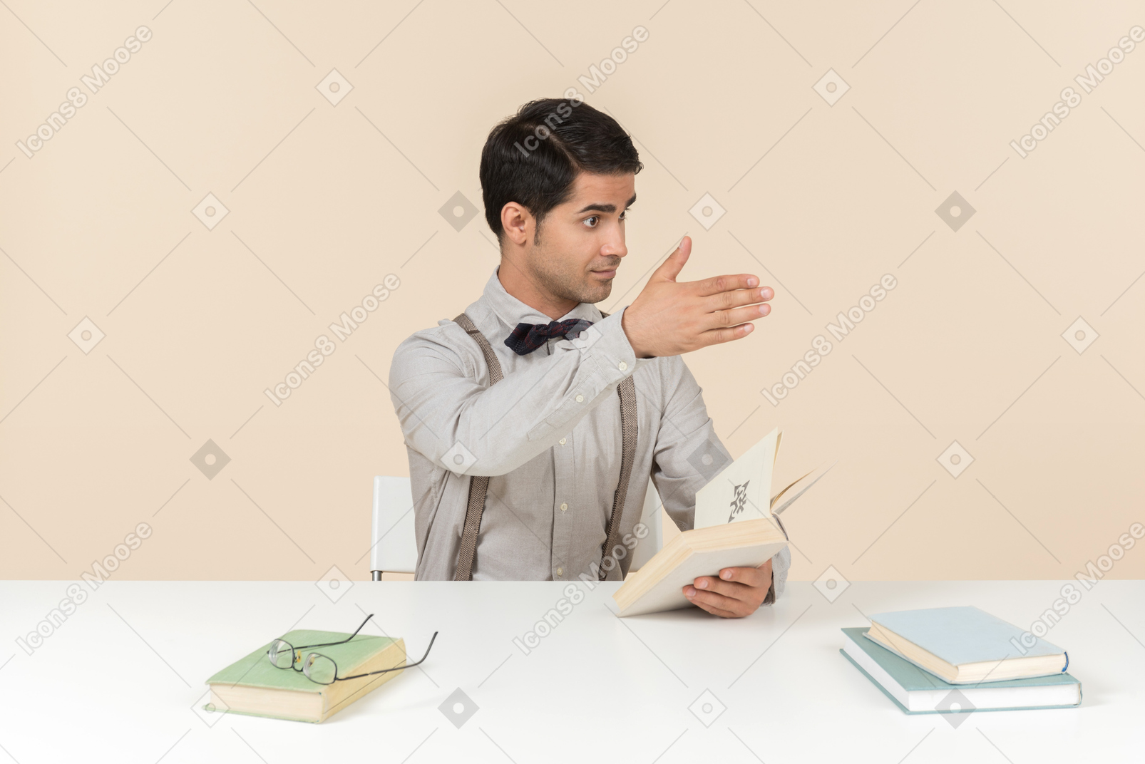 Young professor explaining something and pointing with a hand