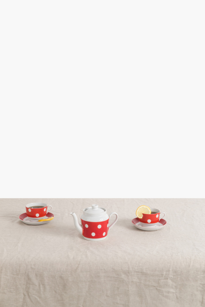 Sovietic russian polka dot tea cups filled with tea and lemon slice