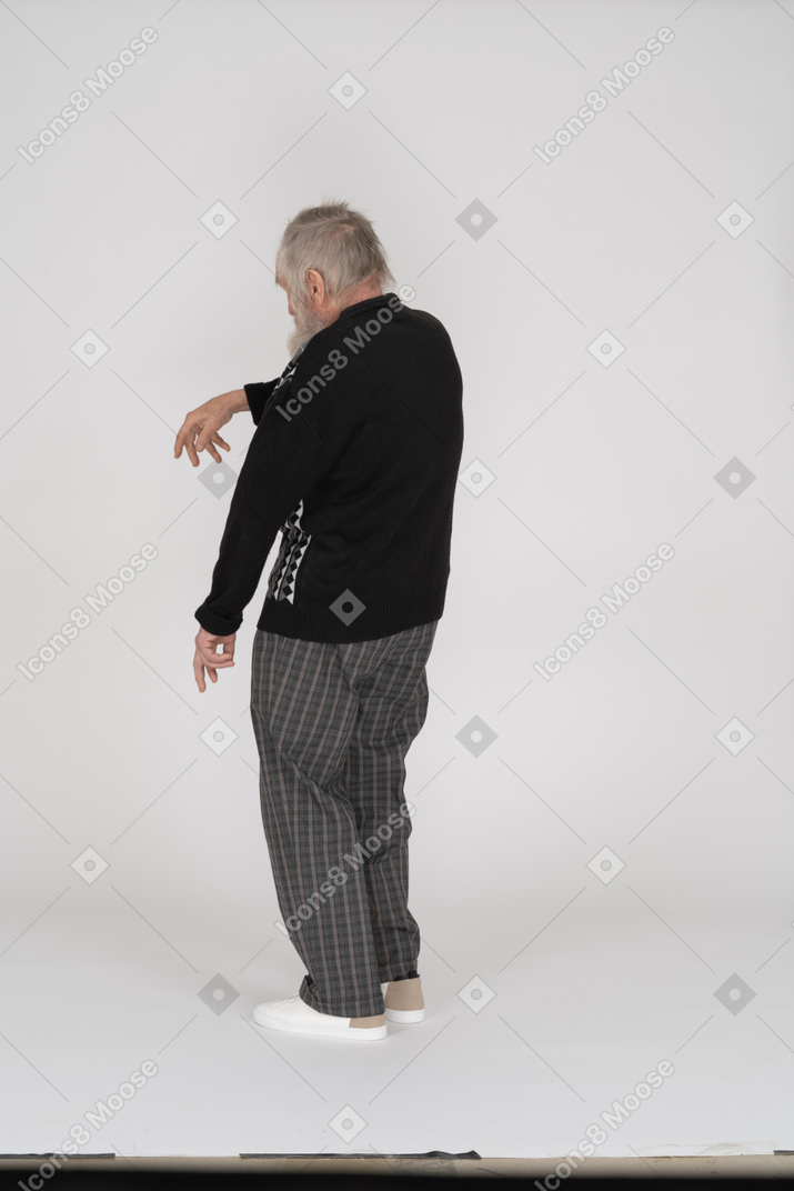 Back view of old man gesticulating