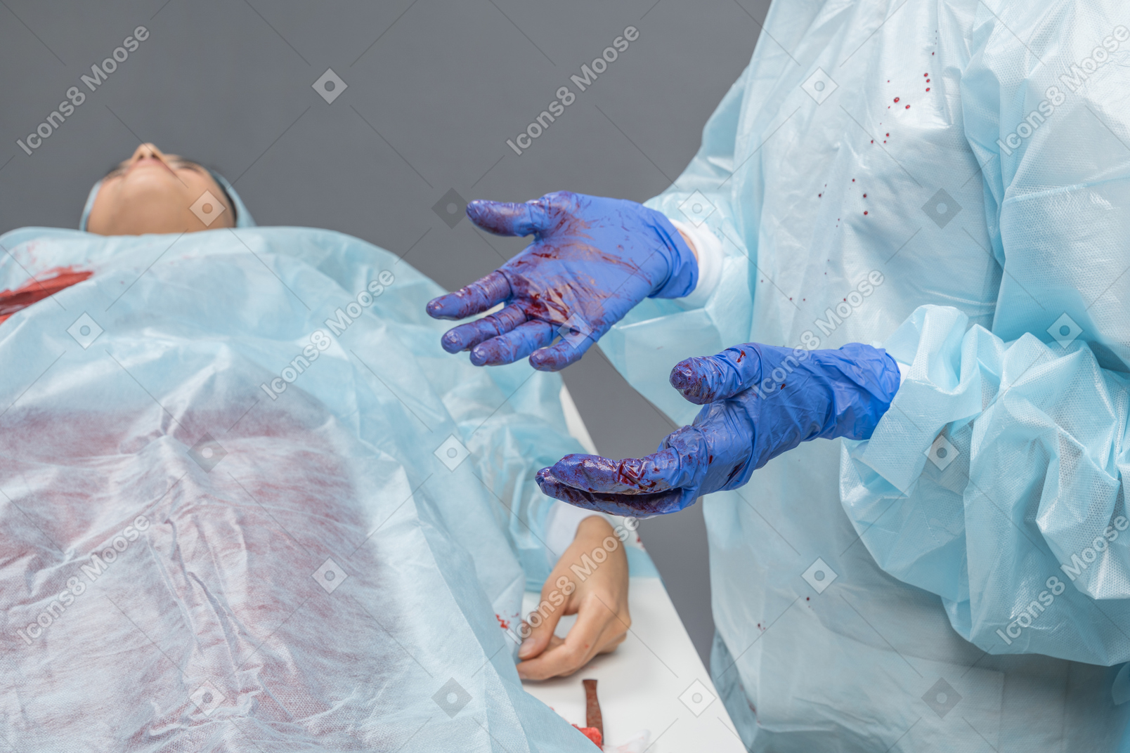 Doctor holding hands in front of her during operation