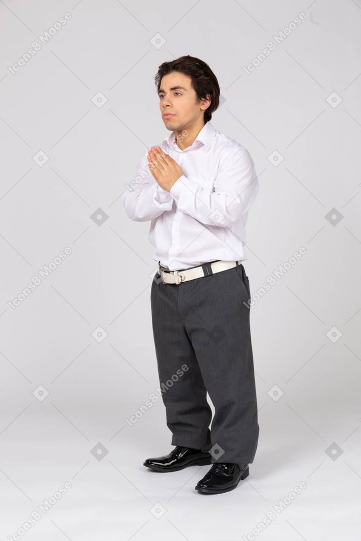 Male office worker with folded hands