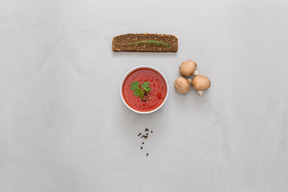 Bowl of tomato sauce, snacks and mushrooms