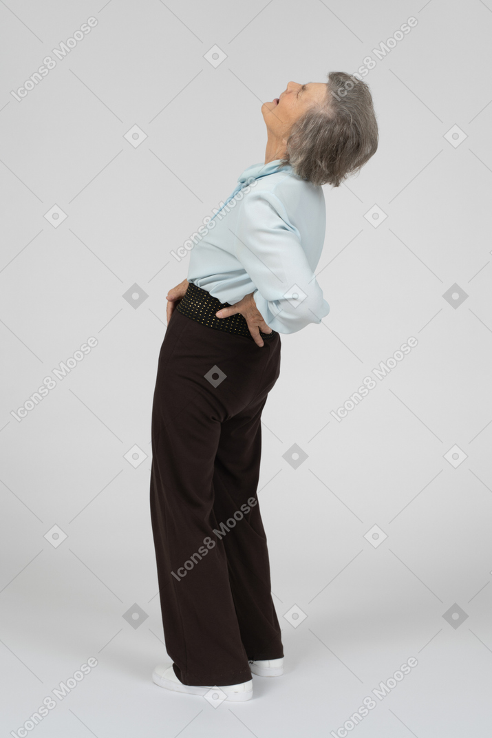 Old woman suffering from back pain