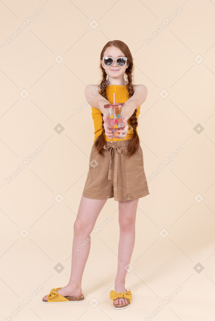 Stylish teenager kid girl holding plastic cup