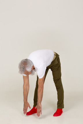 Front view of a man doing bending exercises