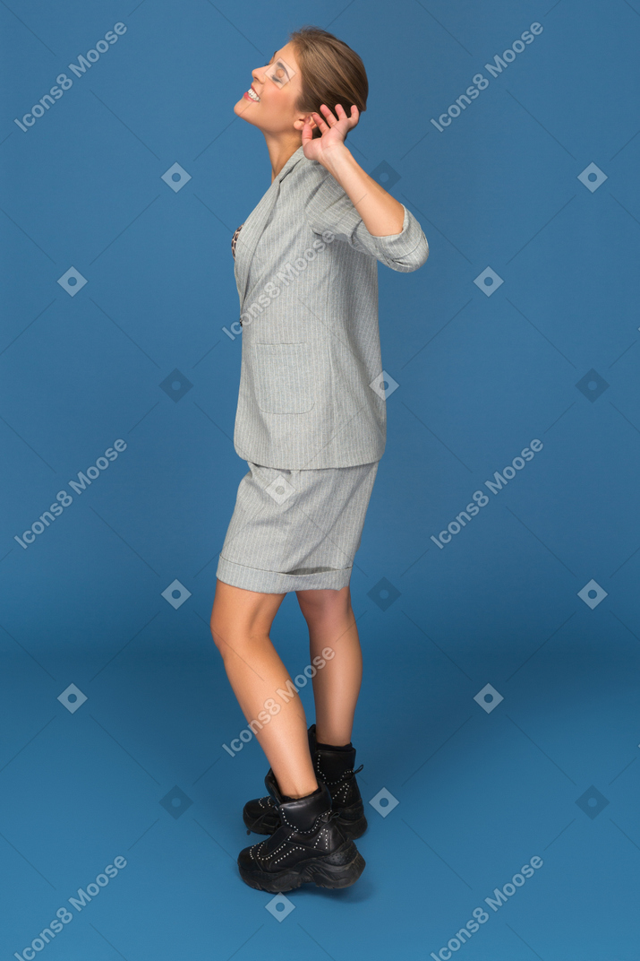 Young woman stretching sideways to camera