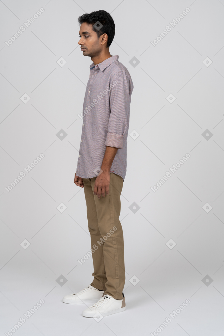 Young man in casual clothes standing