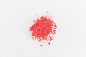 Red powder on white background