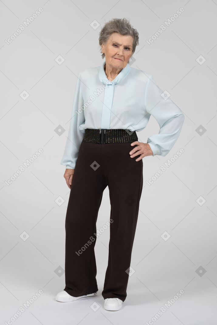 Front view of an old woman squinting suspiciously