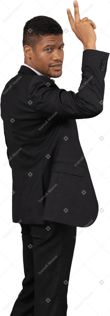 Man in black suit standing