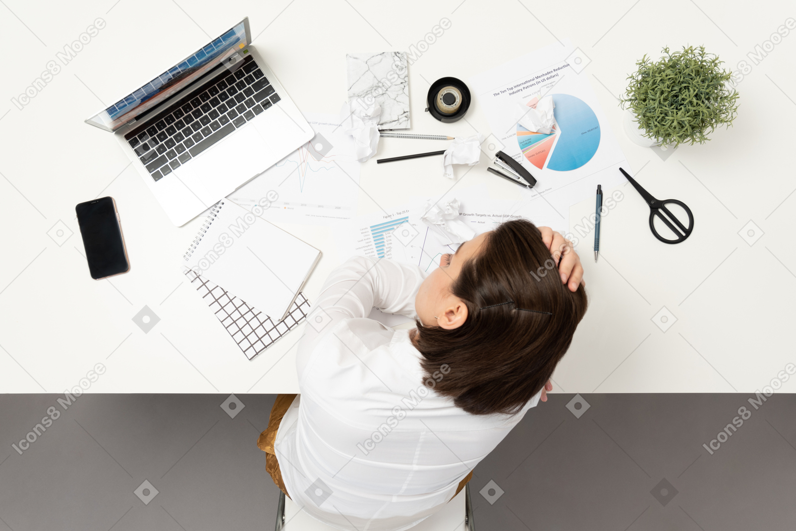 A frustrated female office worker at the table