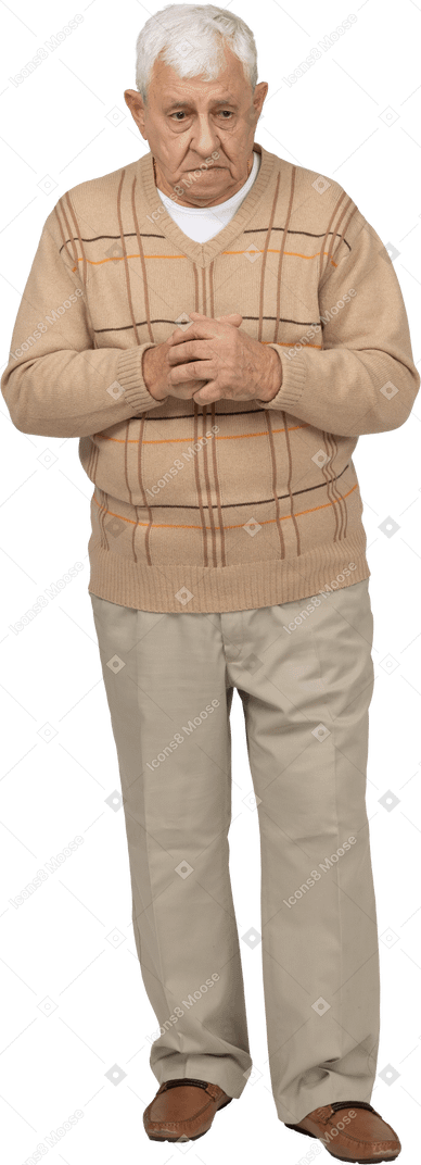 Front view of a sad old man in casual clothes