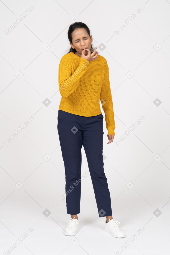 Front view of a girl in casual clothes whistling