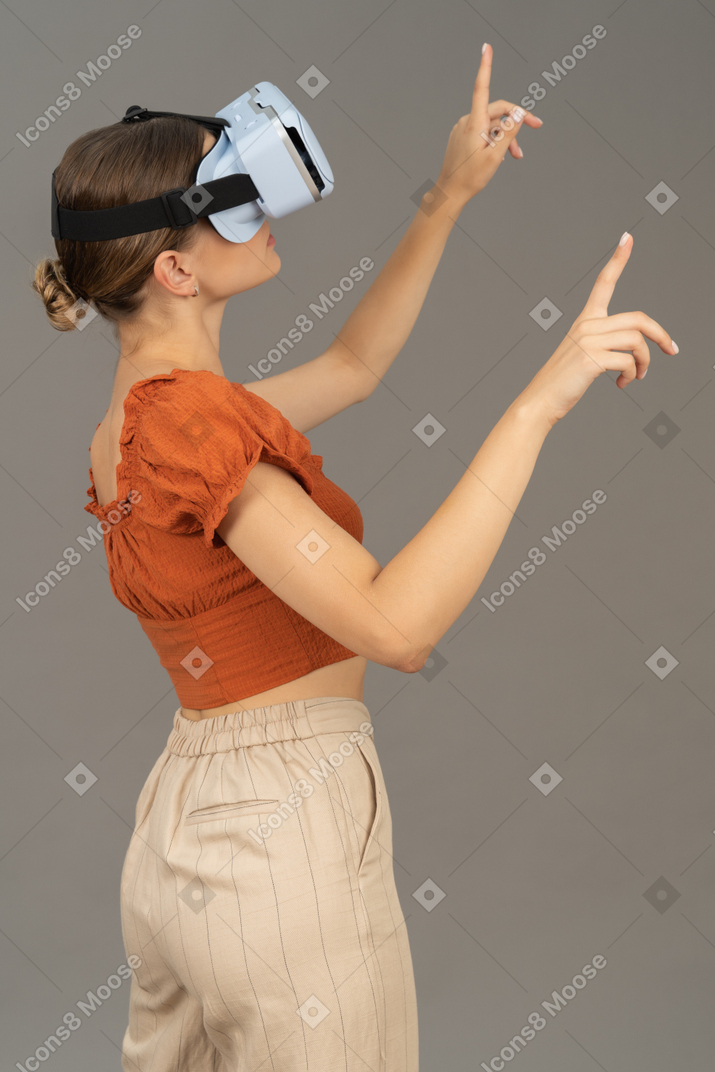 Side view of young woman in vr headset