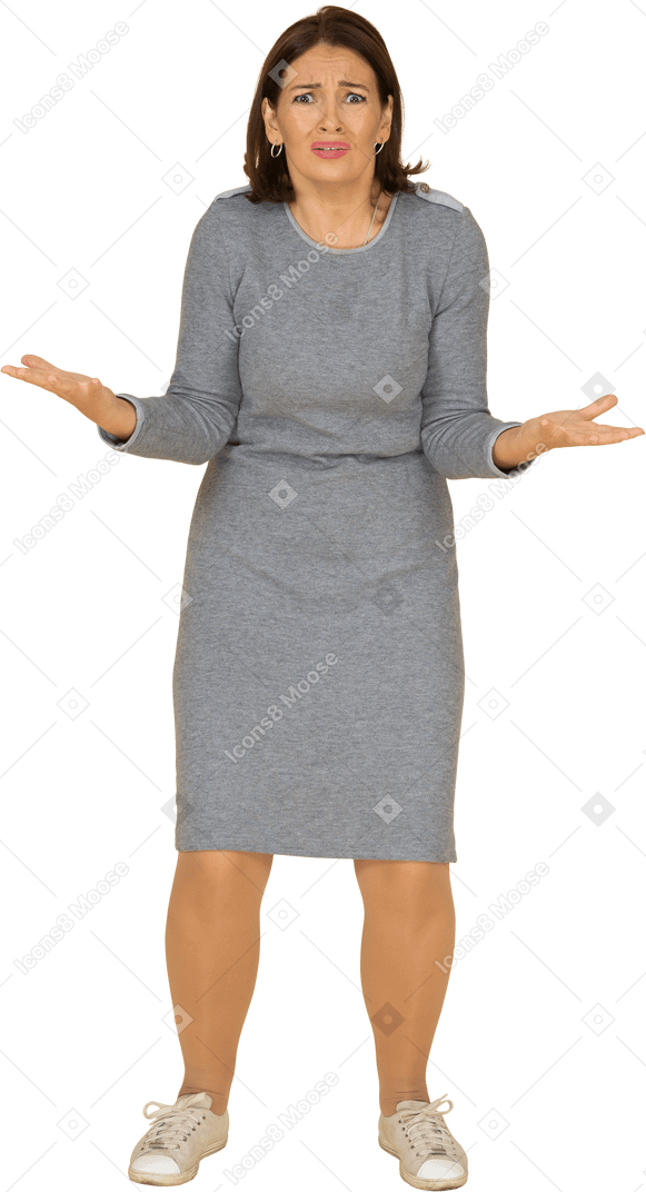 Front view of a scared woman in grey dress