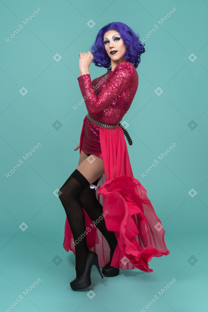 Portrait of a drag queen in pink floating skirt dancing