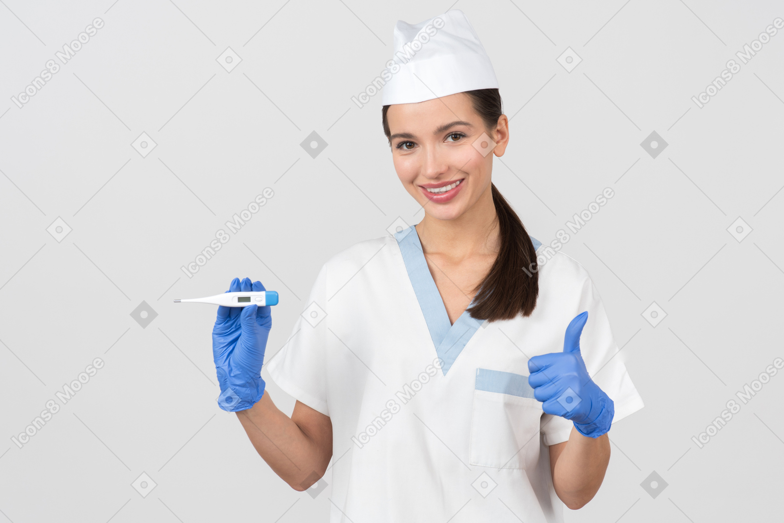 Attractive nurse showing a digital thermometer