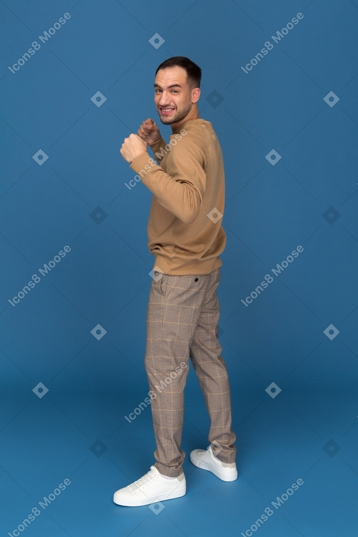 Happy young man ready to fight