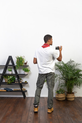 Good looking young man with a camera