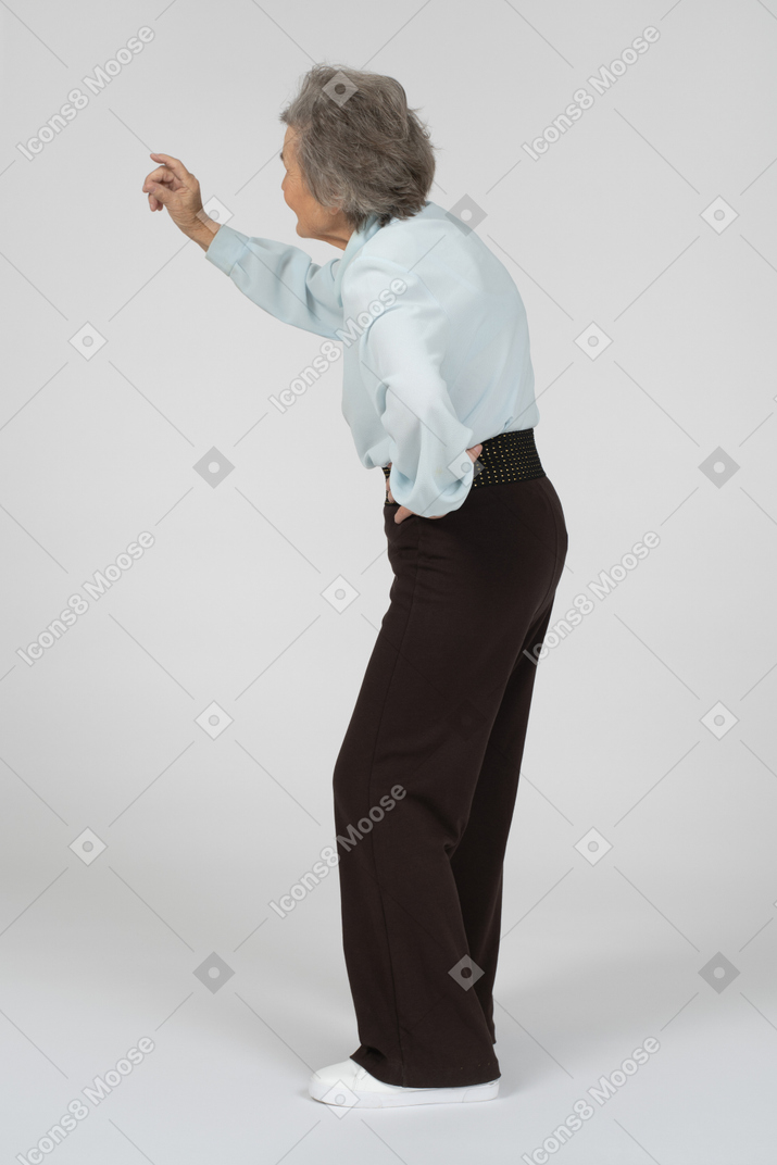 Old woman with raised hand